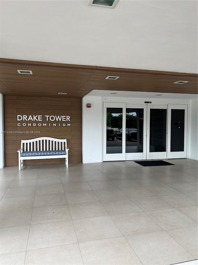 interior space featuring tile patterned flooring and visible vents