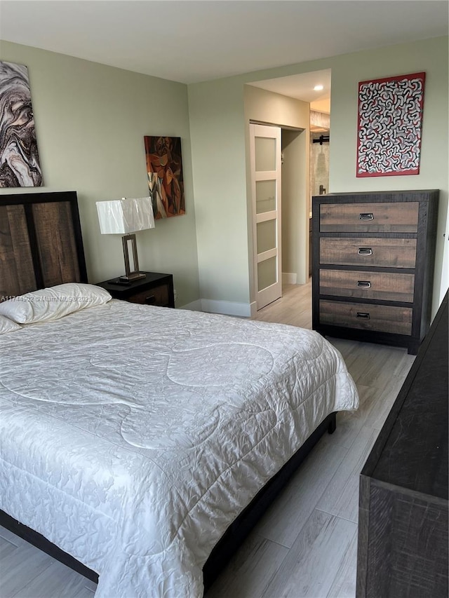 bedroom featuring light wood-type flooring