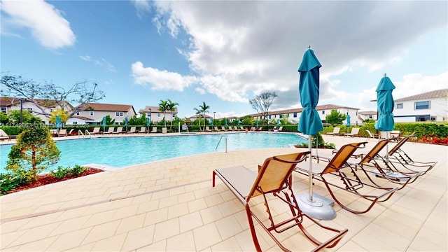 community pool featuring a patio area