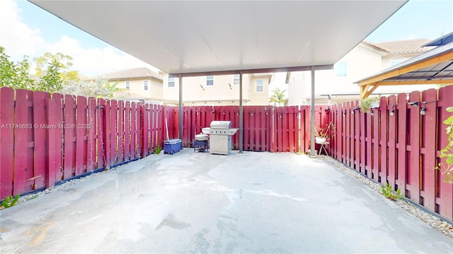 view of patio / terrace featuring a fenced backyard and a grill