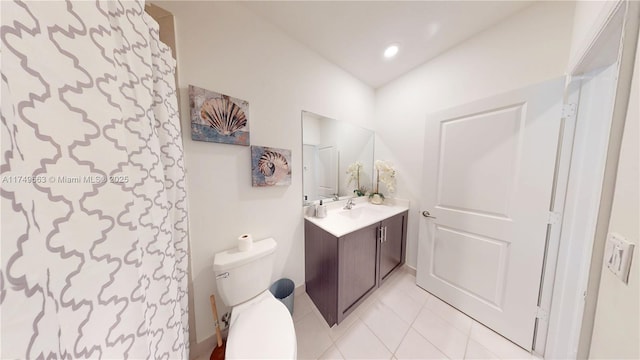 bathroom with toilet, tile patterned flooring, vanity, and recessed lighting