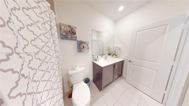 bathroom with vanity, tile patterned flooring, toilet, and recessed lighting