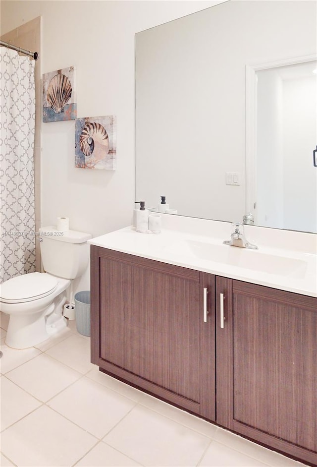 full bath with vanity, toilet, and tile patterned floors