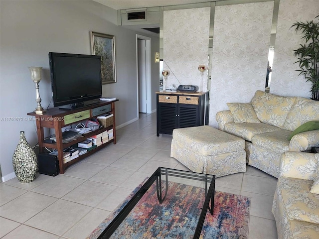 tiled living area featuring visible vents and baseboards