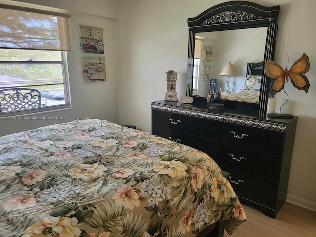 bedroom featuring light wood-type flooring