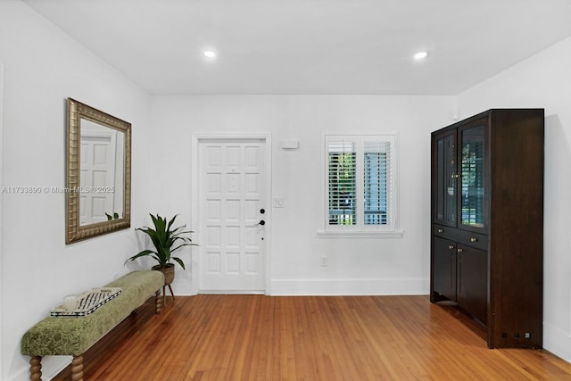 foyer entrance featuring recessed lighting, baseboards, and wood finished floors