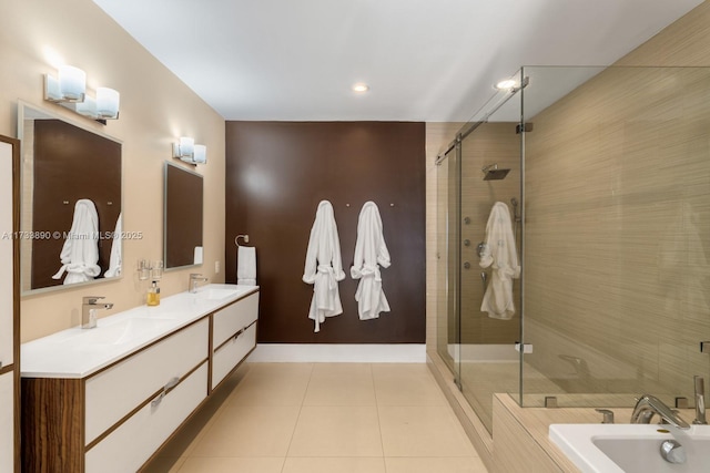 full bathroom with double vanity, a stall shower, tile patterned floors, a sink, and a bath