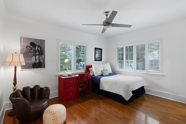 bedroom featuring ceiling fan, dark wood-type flooring, and baseboards