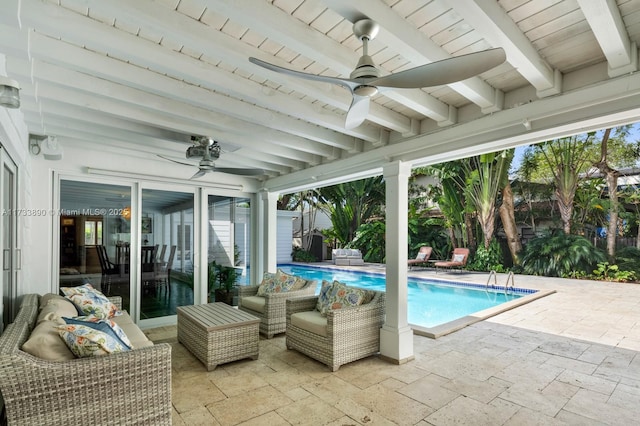 pool with ceiling fan, outdoor lounge area, and a patio area