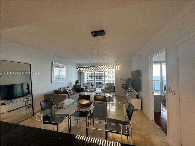 dining area with light tile patterned floors and ornamental molding