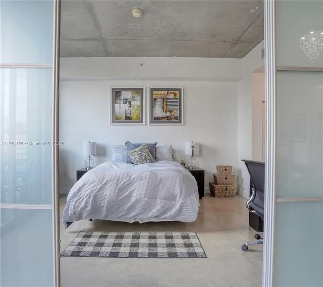 bedroom featuring finished concrete flooring