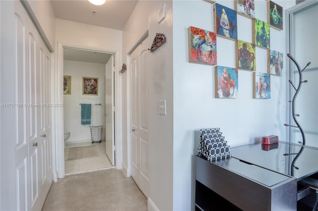 corridor with concrete floors