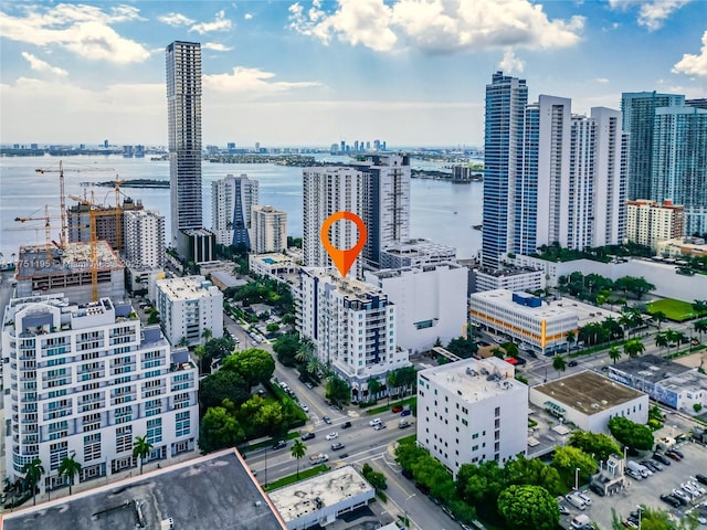 aerial view featuring a water view and a city view