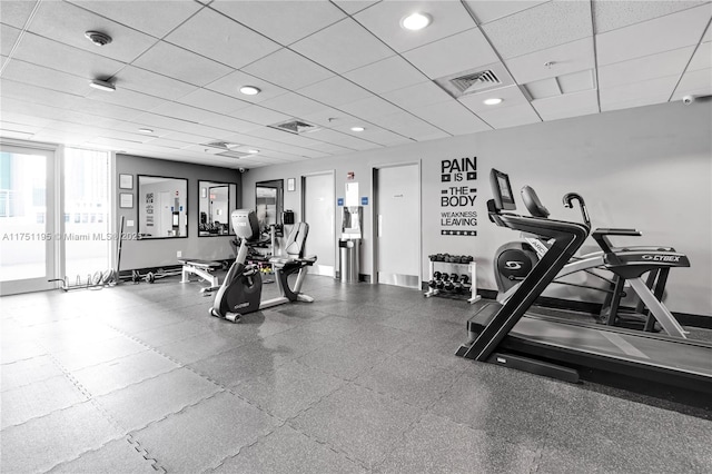 workout area featuring recessed lighting, baseboards, visible vents, and a drop ceiling