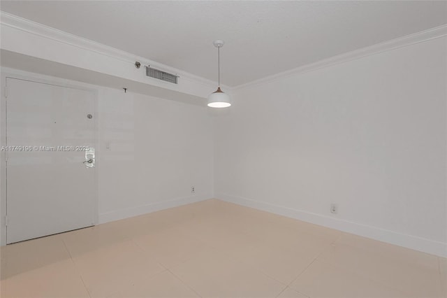 empty room featuring light tile patterned floors, ornamental molding, visible vents, and baseboards