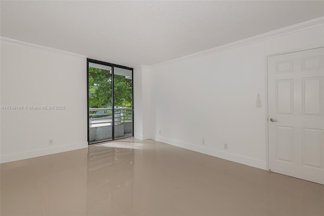 empty room with expansive windows, crown molding, a textured ceiling, and baseboards