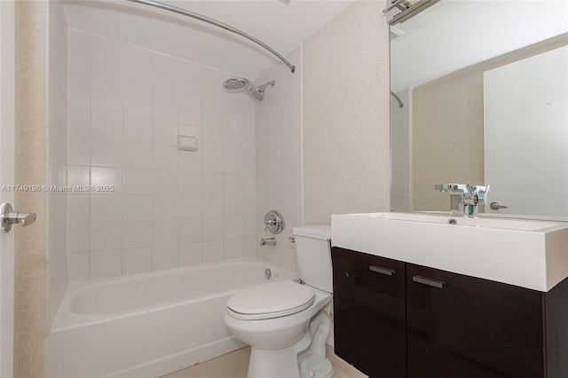 bathroom featuring tub / shower combination, vanity, and toilet