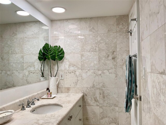 325 Ocean Dr Unit 308, Miami Beach, FL 33139 - bathroom featuring vanity and tile walls