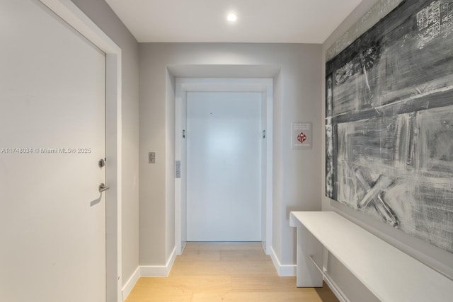 interior space with light wood-type flooring and baseboards