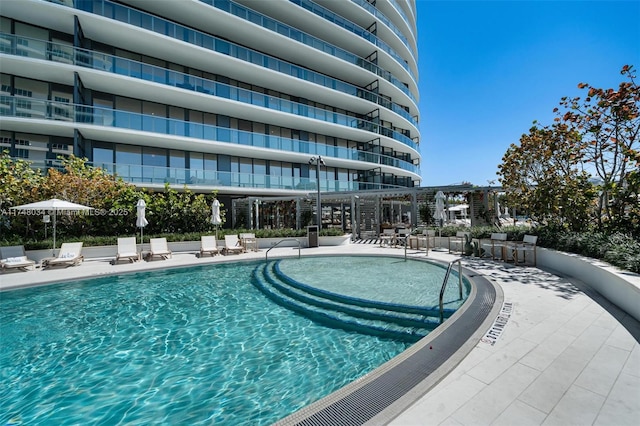 community pool featuring a patio area