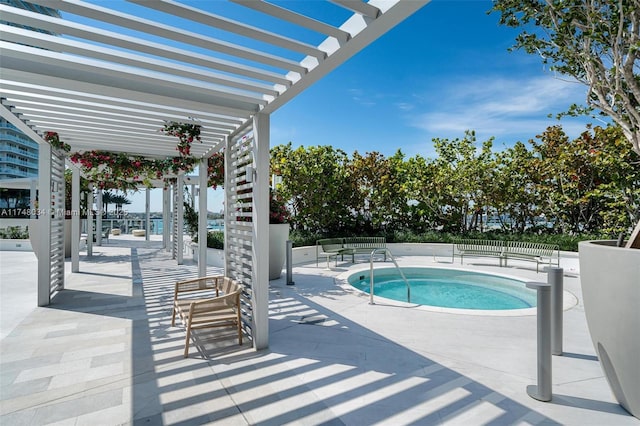 view of swimming pool featuring a patio area, a pool, and a pergola