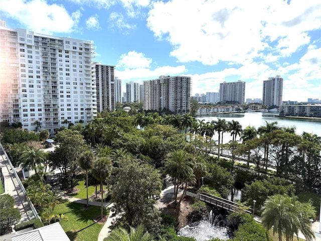 drone / aerial view with a view of city and a water view