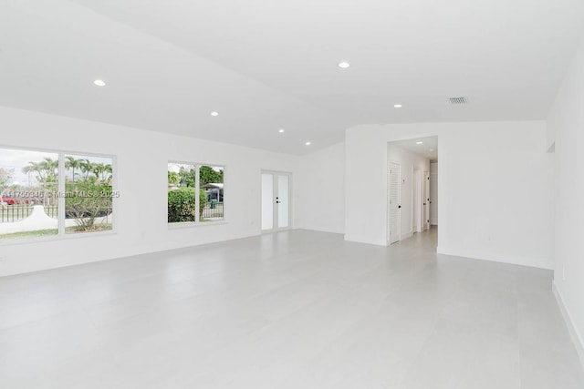 interior space with vaulted ceiling, visible vents, and recessed lighting