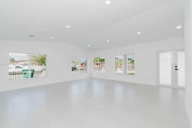 interior space featuring vaulted ceiling, french doors, visible vents, and recessed lighting