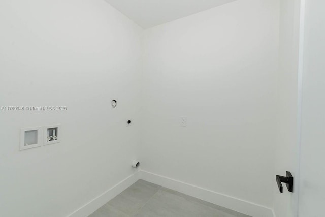 clothes washing area featuring laundry area, baseboards, washer hookup, and hookup for an electric dryer