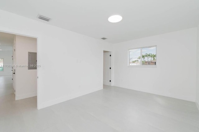 unfurnished room featuring visible vents and baseboards