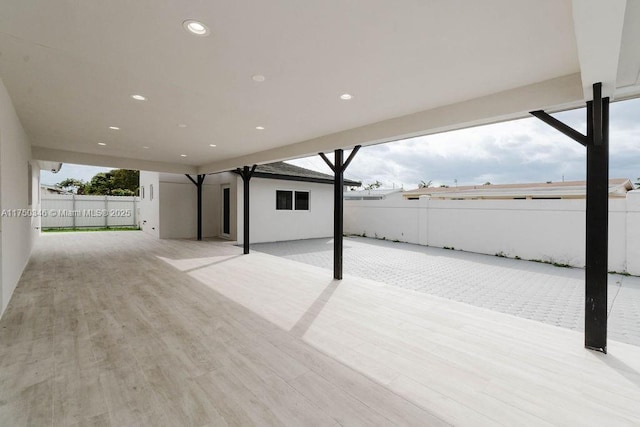 view of patio / terrace featuring fence