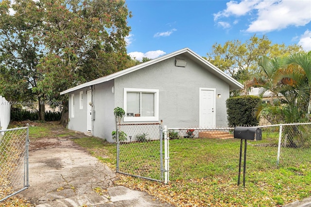 view of home's exterior featuring a lawn, fence private yard, and stucco siding