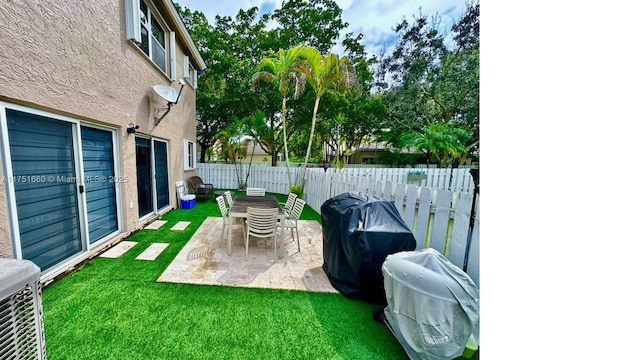 exterior space with fence and grilling area