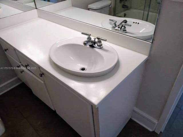 bathroom featuring vanity, an enclosed shower, and tile patterned flooring