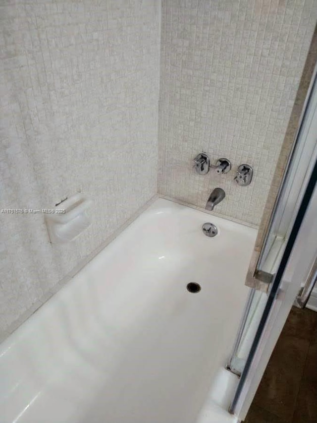 full bathroom with a tub to relax in