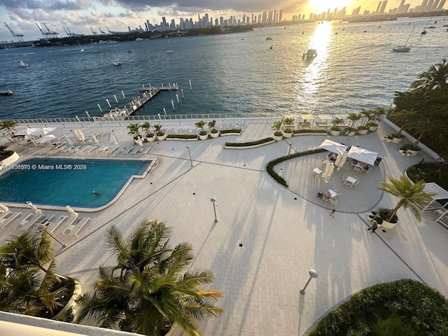 aerial view featuring a city view and a water view