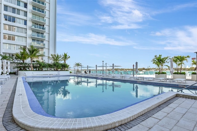 community pool featuring a patio area