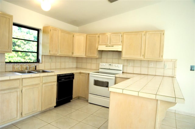 kitchen with tile countertops, under cabinet range hood, black dishwasher, white range with electric stovetop, and light brown cabinetry