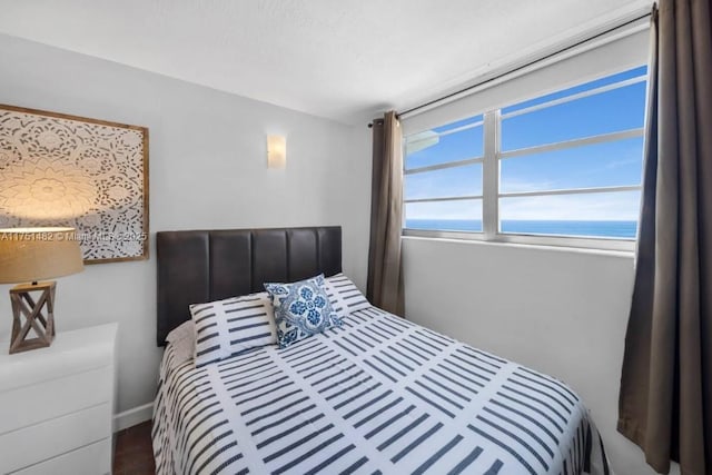 bedroom featuring a water view