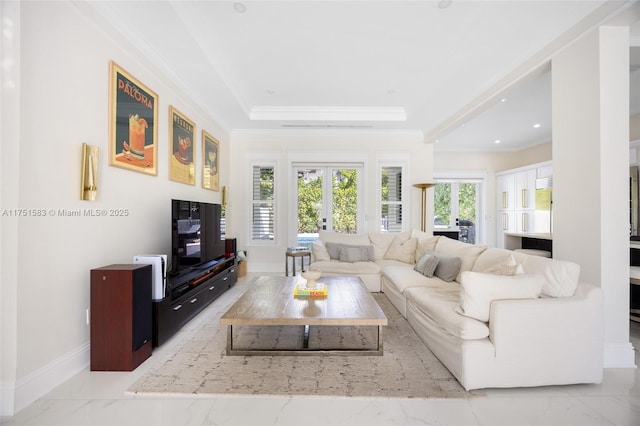 living area with marble finish floor, ornamental molding, a raised ceiling, and french doors