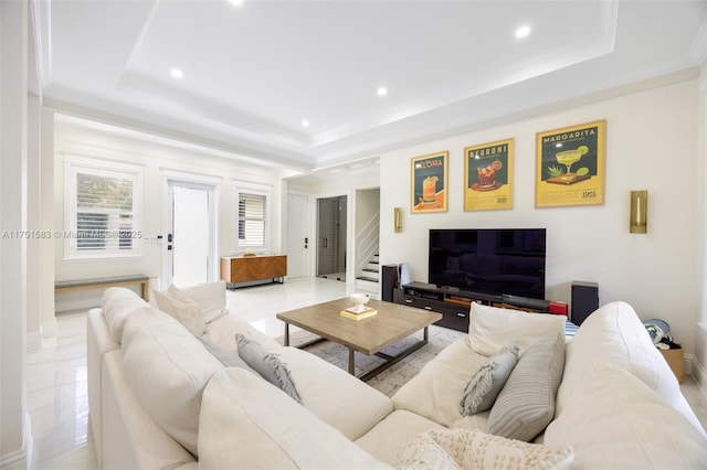 living area featuring a raised ceiling, crown molding, and recessed lighting