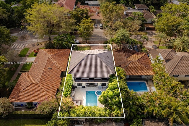 birds eye view of property with a residential view