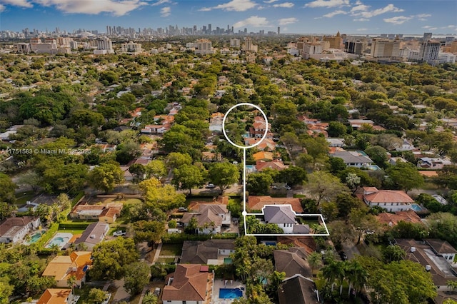 birds eye view of property with a city view