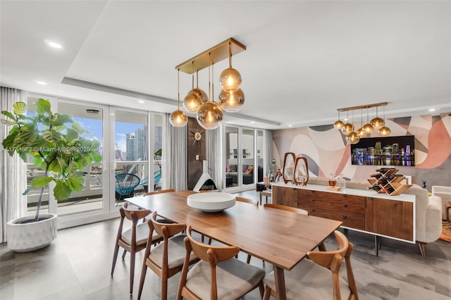 dining area featuring french doors, recessed lighting, and an inviting chandelier