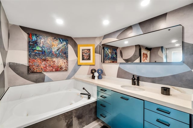 full bath featuring vanity, recessed lighting, and a bath