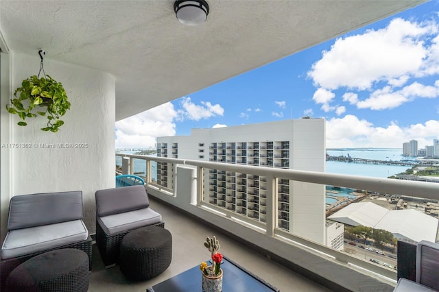 balcony with a city view and a water view