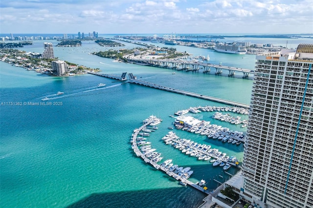 bird's eye view featuring a water view and a view of city