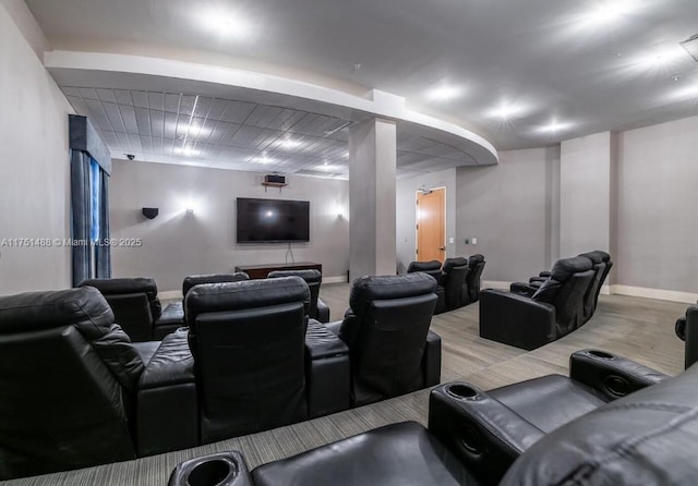 home theater room featuring baseboards