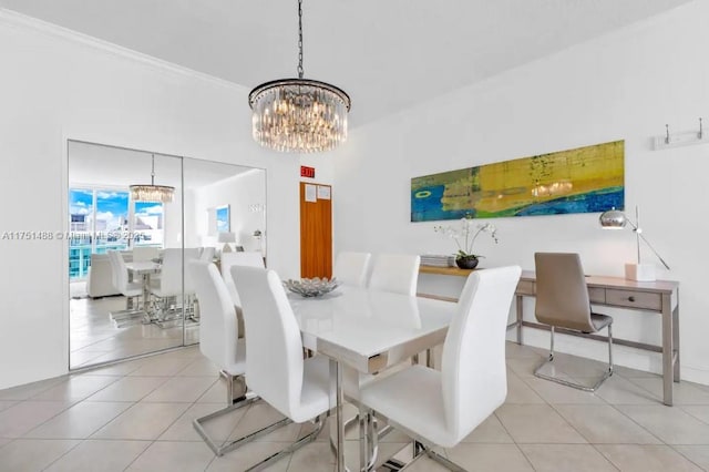 dining area with light tile patterned floors and a notable chandelier