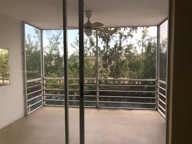 3660 NE 166th St Unit 305, North Miami Beach, FL 33160 - unfurnished sunroom featuring ceiling fan, healthy amount of natural light, and a water view
